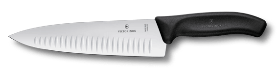 Victorinox Fibrox chef's knife with fluted blade and black handle on white background